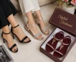 Stylish shoes for women including black heels, silver sandals, and maroon sandals