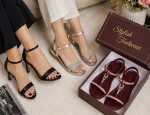 Stylish shoes for women including black heels, silver sandals, and maroon sandals